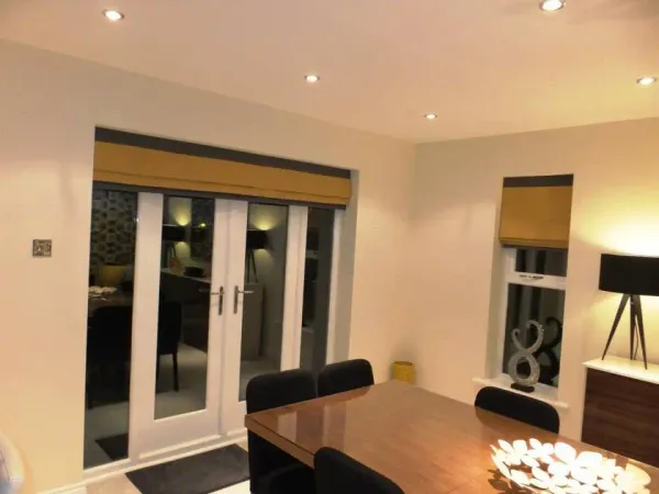 Gold and charcoal roman blinds in an Edinburgh dining room